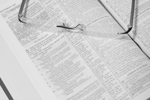 Open Bible with glasses